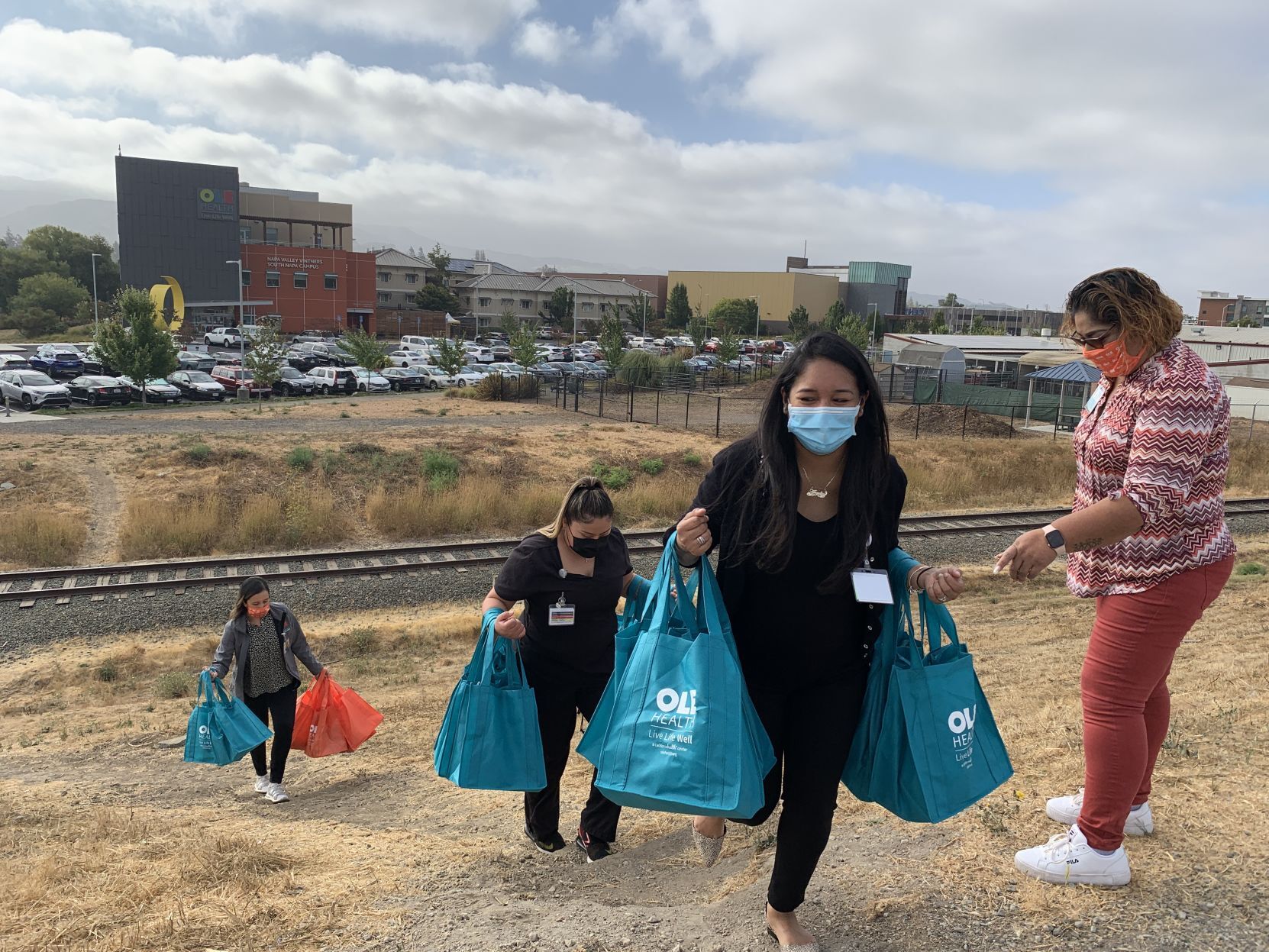 OLE Health distributes care bags to residents of the Bowl